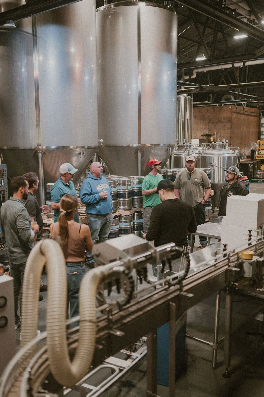 Tour group learning about brewing at Mocama Beer Company