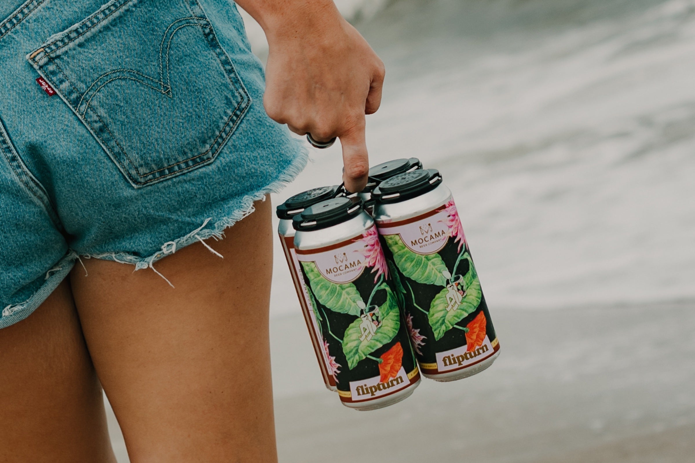A four-pack of flipturn blonde ale carried at the beach